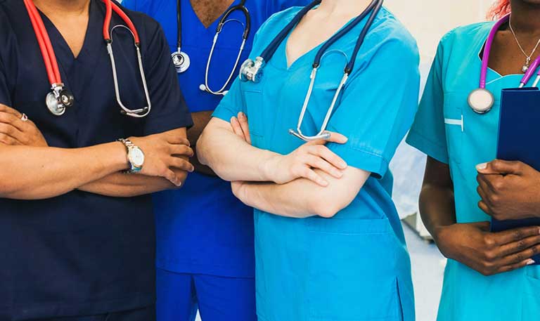 Faceless medical staff lined up