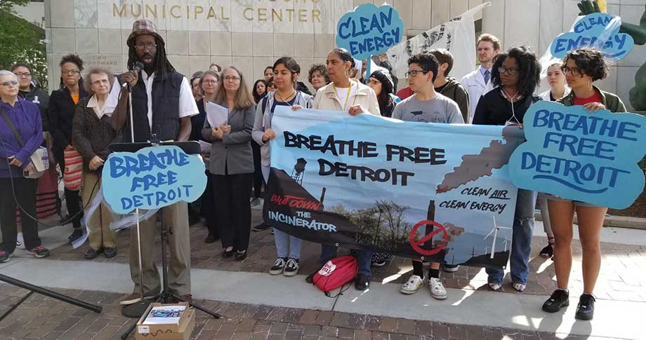 People gathering outside with protest signs