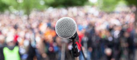 a microphone with a crowd of people