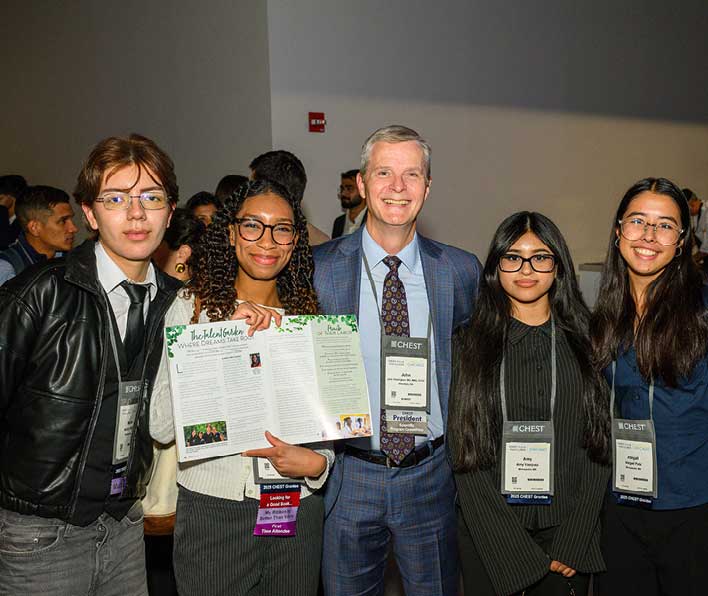 Hennepin Healthcare Talent Garden CHEST Scholars pose for a picture with CHEST President Dr. John Howington